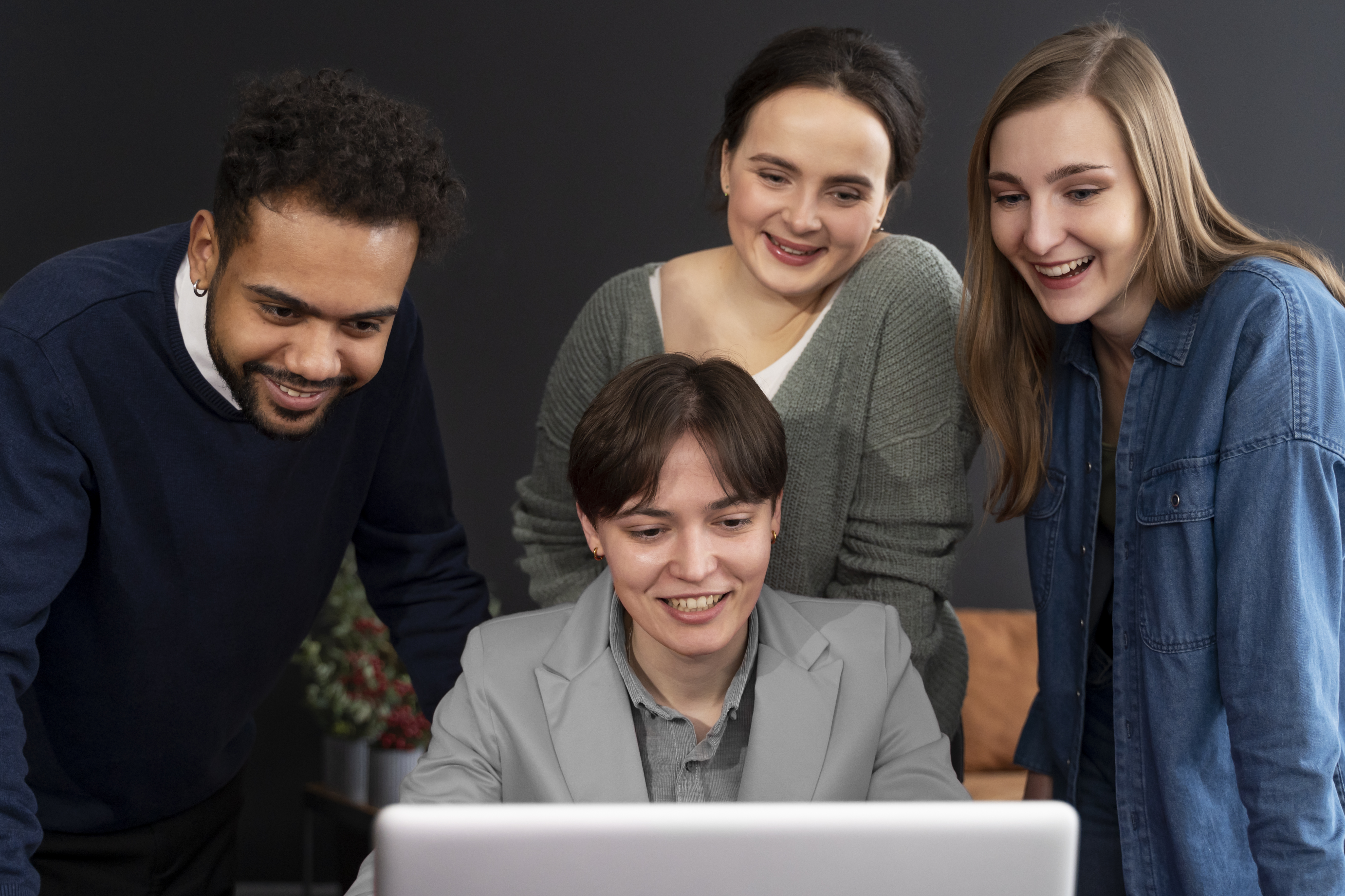 People collaborating at a computer